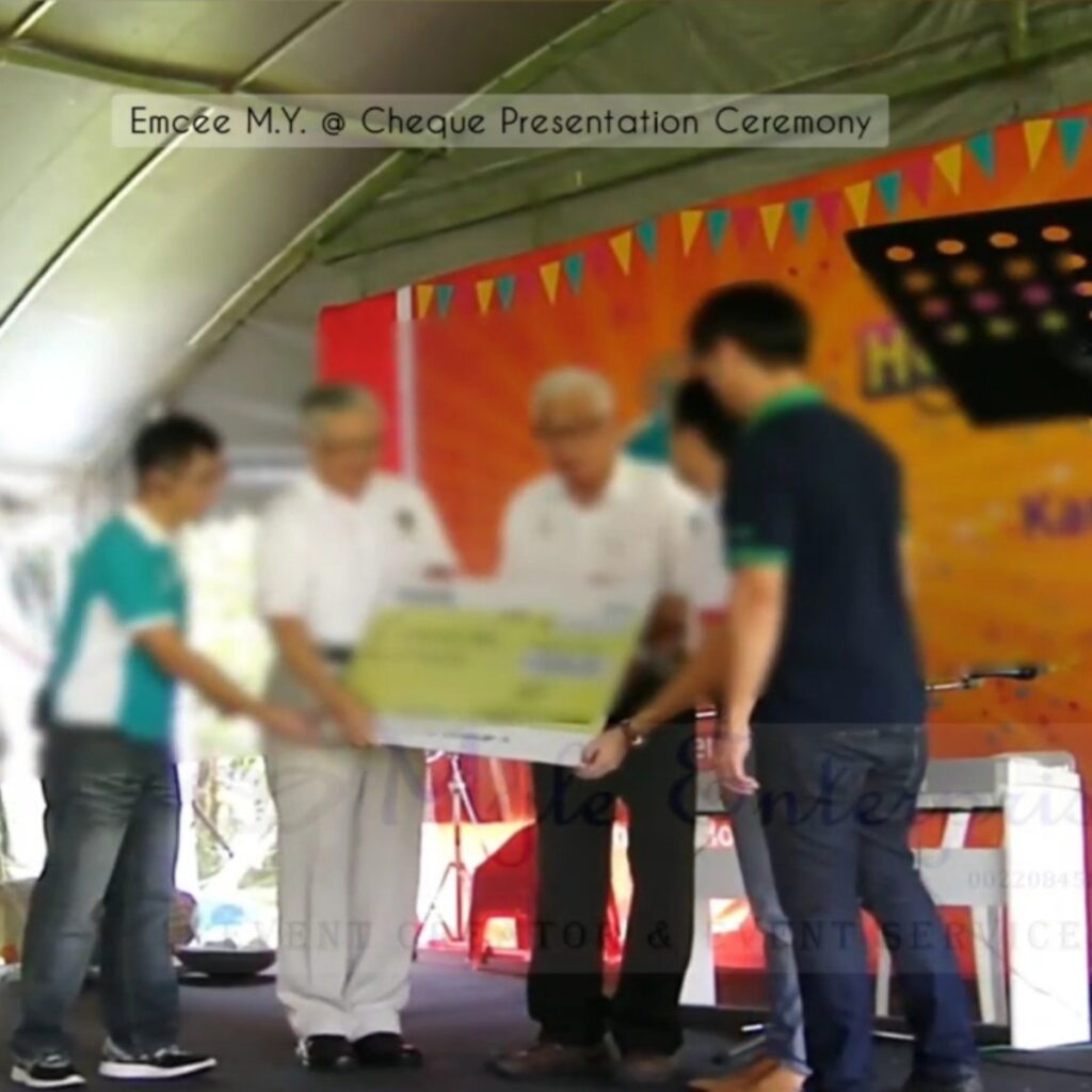 Emcee M.Y. at SNHP Carnivals Cheque Presentation